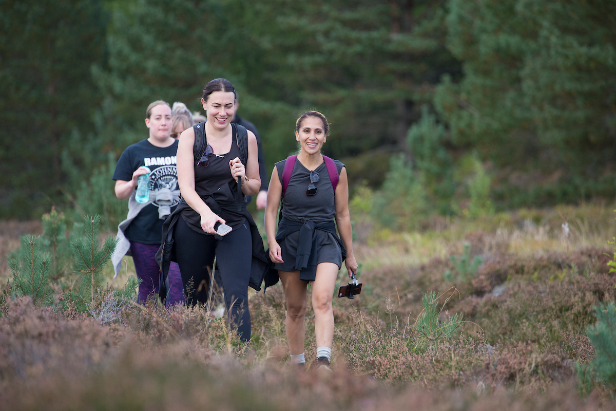 Group of young women walking in the Cairngorms National Park, Scotland.